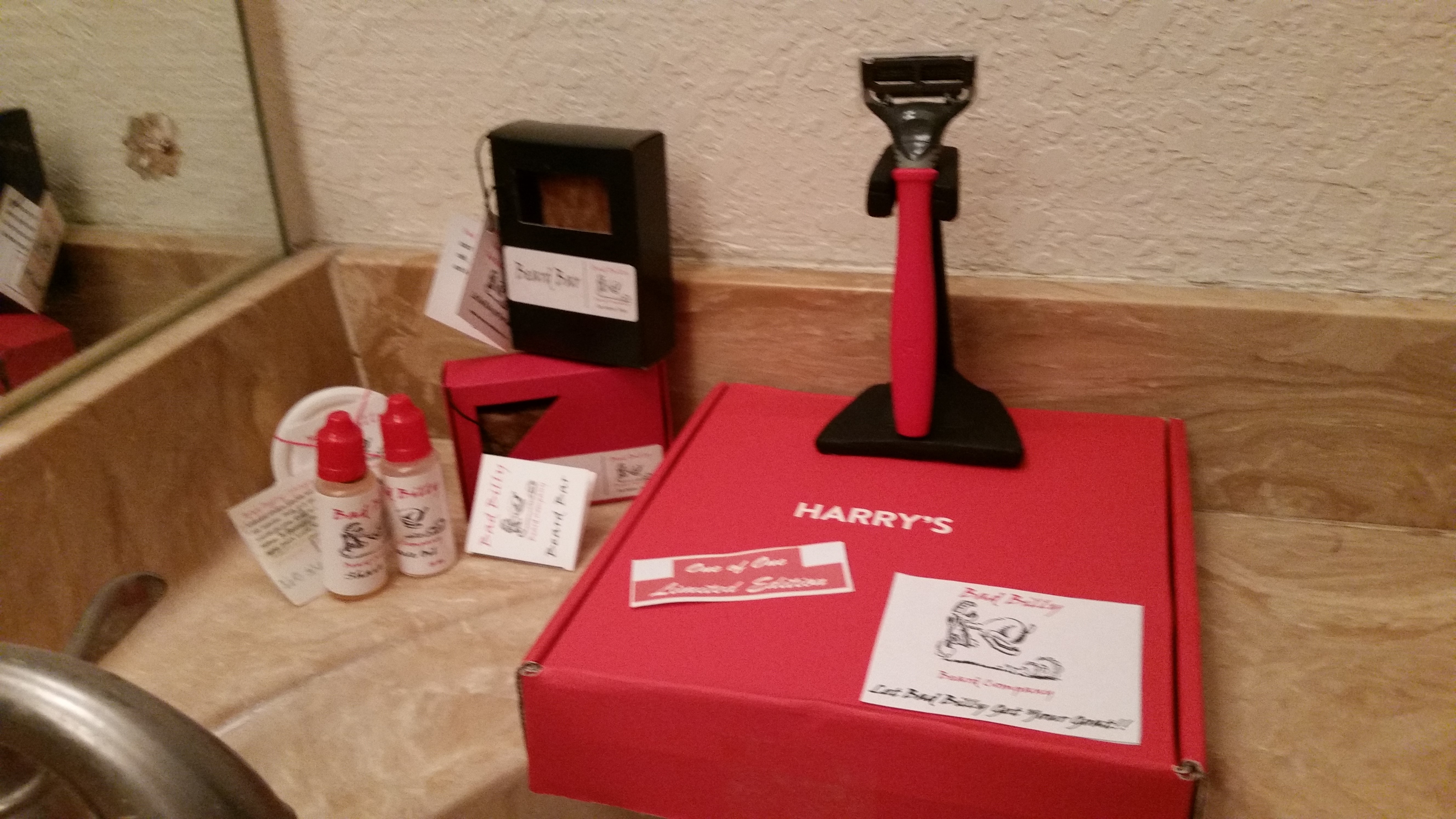 So here’s my new “One of One, Limited Edition” razor resting against the exclusive Bad Billy Beard black razor stand and sitting by Bad Billy Shave oil, Bad Billy Beard Bars and in the back, Bad Billy Beard Balm!! All in our signature colors of red, black and white. We couldn’t be more proud!! Harrys and BB!